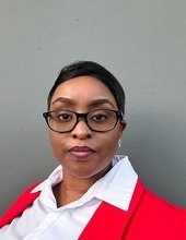 Black woman in red sweater, gray background