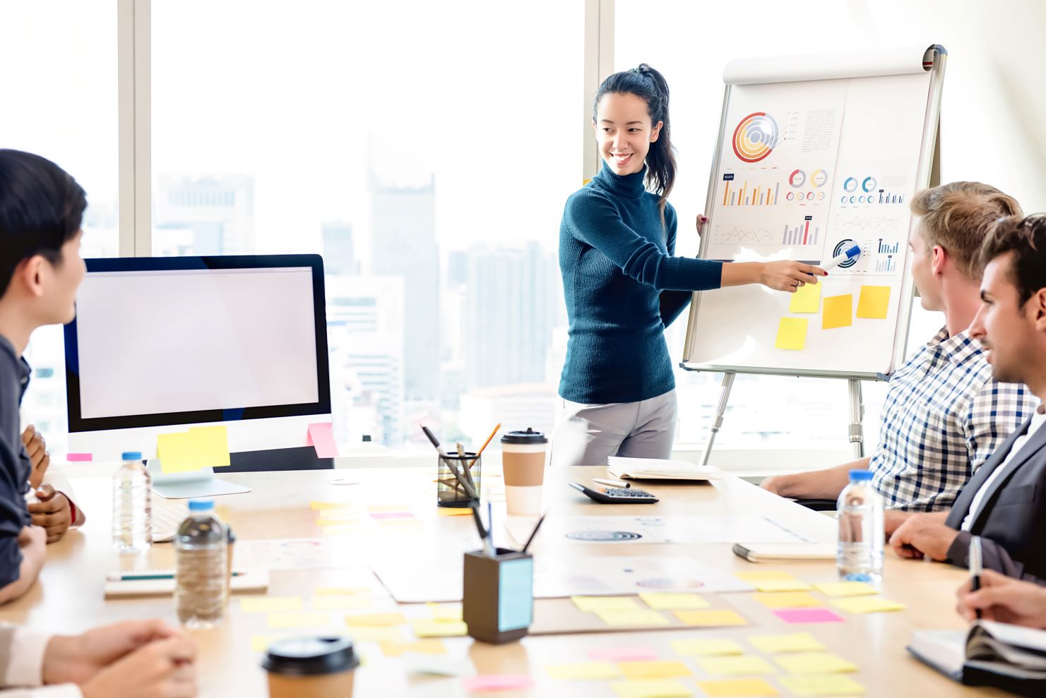 Young woman presenting research in office meeting