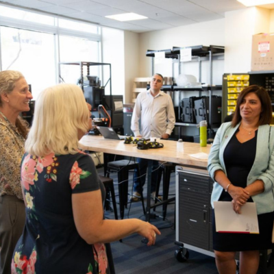 UMB and UCR researchers tour a UMB facility